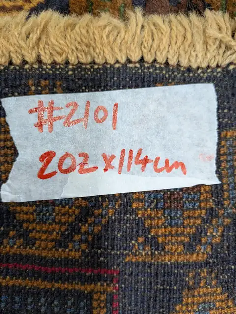 The back of rug 2101 with its size tag
