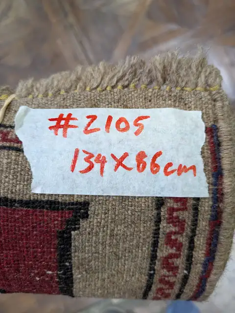 The back of rug 2105 with its size tag