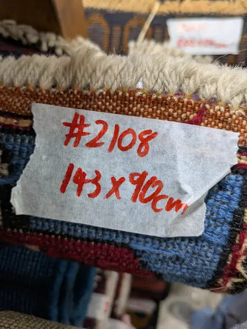 The back of rug 2108 with its size tag